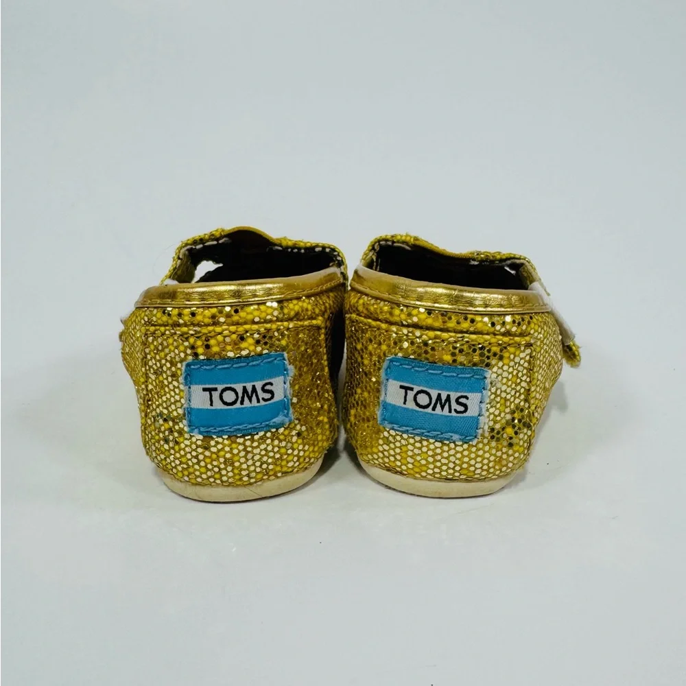 TOMS 2T Yellow Gold Sparkly Toddler Shoes with Velcro Strap.